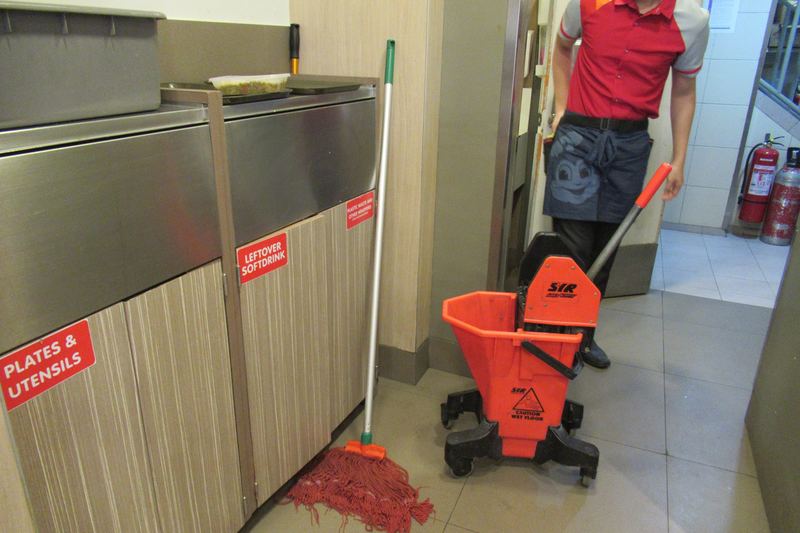 Professional mop buckets lined up for cleaning work